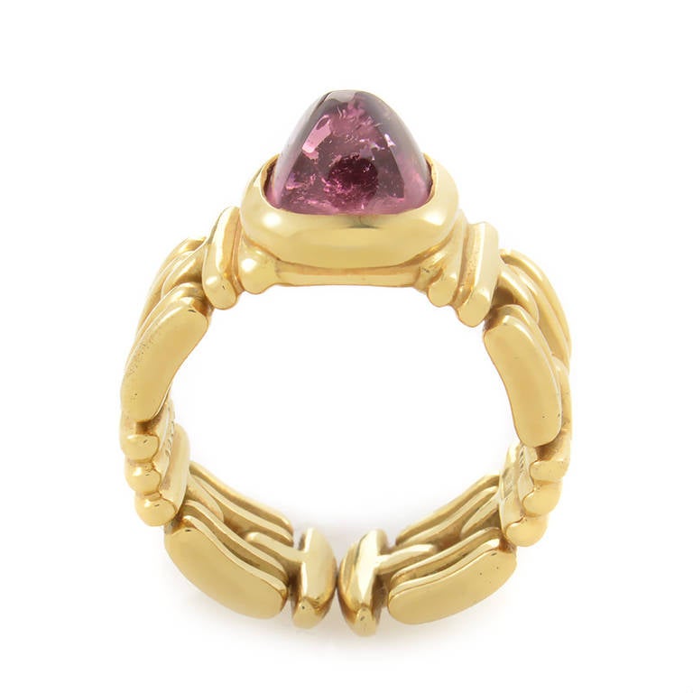 Gorgeously colored, and absolutely breathtaking, this ring from Bvlgari is a dream come true! The ring is made of 18K yellow gold and features a bezel-set pyramid-shaped pink tourmaline cabochon in the design.
Ring Size: 5.75 (50 7/8)