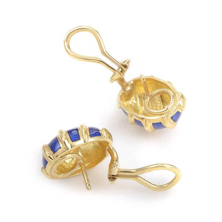 Schlumberger's collection of jewelry created for Tiffany & Co. are some of the brand's most well known and beloved designs. This pair of earrings from the collection are made of 18K yellow gold and are accented with a beautiful blue enamel.