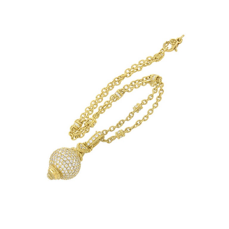This enhancer necklace from Judith Ripka is quite luxurious and is sure to garner much attention. The necklace is made of 18K yellow gold as is the enhancer pendant. Lastly, the pendant and pendant bail are set with a diamond pave.
Approximate