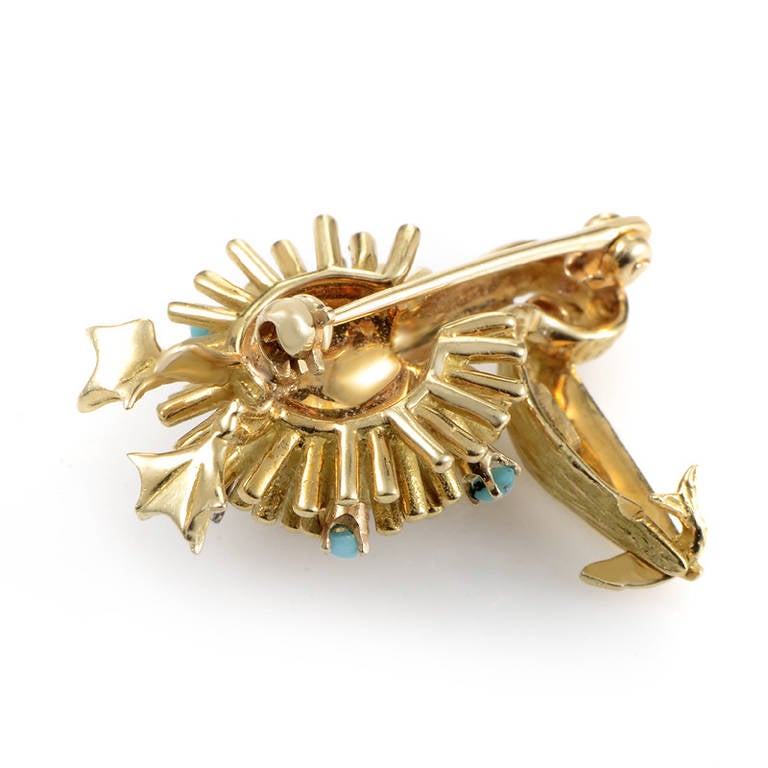 This dazzling gemstone-set brooch was intricately designed to perfection. The brooch is made of solid 18K yellow gold and is shaped to look like a pelican. The bird's body is studded with diamonds and turquoise stones as well as a single ruby eye.