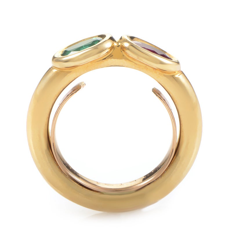 The compelling design of this gemstone-set ring from Chaumet is absolutely stunning! The delicate 18K yellow gold band is accentuated with only two gemstones- a bezel-set emerald and ruby.
Ring Size: 4.0 (46 1/2)
