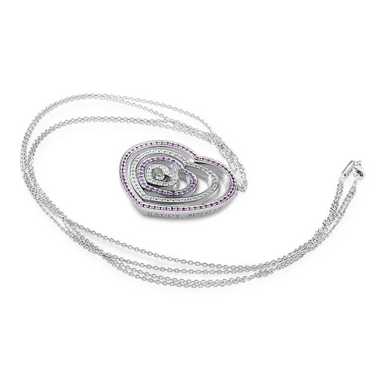 Flirty and fun, the Happy Spirit collection is always a hit! This pendant necklace from the collection is made of 18K white gold and features a heart-shaped pendant that encircles other smaller hearts. Some are set with white diamonds while the