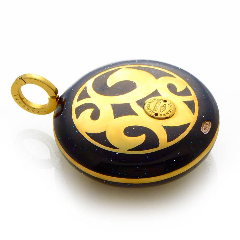 This chainless pendant from Alessandro Fanfani is gorgeous and deeply colored. The pendant is made of 18K yellow gold and boasts a lacquer made to look like a star speckled night sky. Lastly, the pendant is set with ~.49ct of diamonds for additional