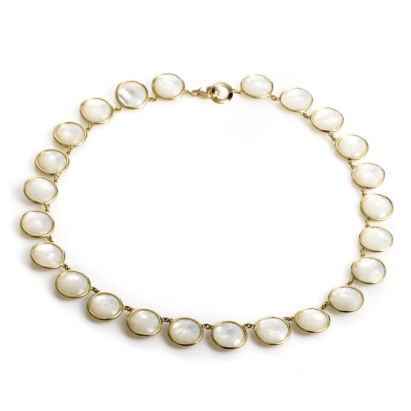 Prepare to be dazzled by the spectacular design of this collar-style necklace from Ippolita! The necklace is made of 18K yellow gold and is accented with bezel-set mother of pearl discs around the entire design.