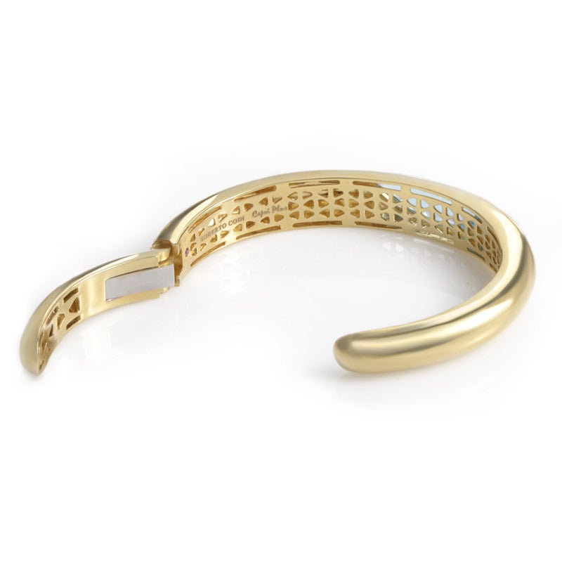 Sensual and serene, this bangle bracelet from Roberto Coin's Capri Plus collection is perfect for mixing and matching with other jewelry. The bracelet is made of 18K yellow gold and is accented with a bed of blue topaz stones.
Retail Price: