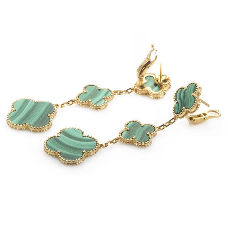 Rich, gorgeous green malachite steals the show in the design of this pair of Van Cleef & Arpels Magic Alhambra earrings. The earrings are made of 18K yellow gold and feature the brand's signature motif in malachite gracefully dropping down the