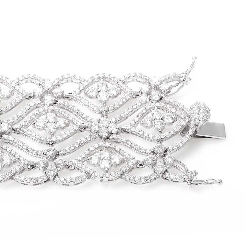 This bracelet is elaborate and elegant. It is made of 18K white gold and boasts a lacy design set with ~19.94ct of diamonds.

Retail Price: $58,000.00 (Plus Tax)