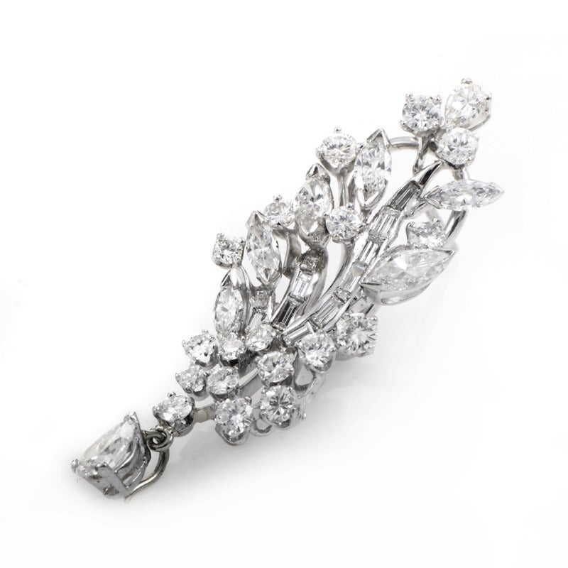 These classically designed antique diamond earrings are absolutely stunning, and have a beauty that will transcend time. The earrings are made of platinum and are set with ~6.75ct of baguette-cut diamonds. round brilliant, marquise-cut, and