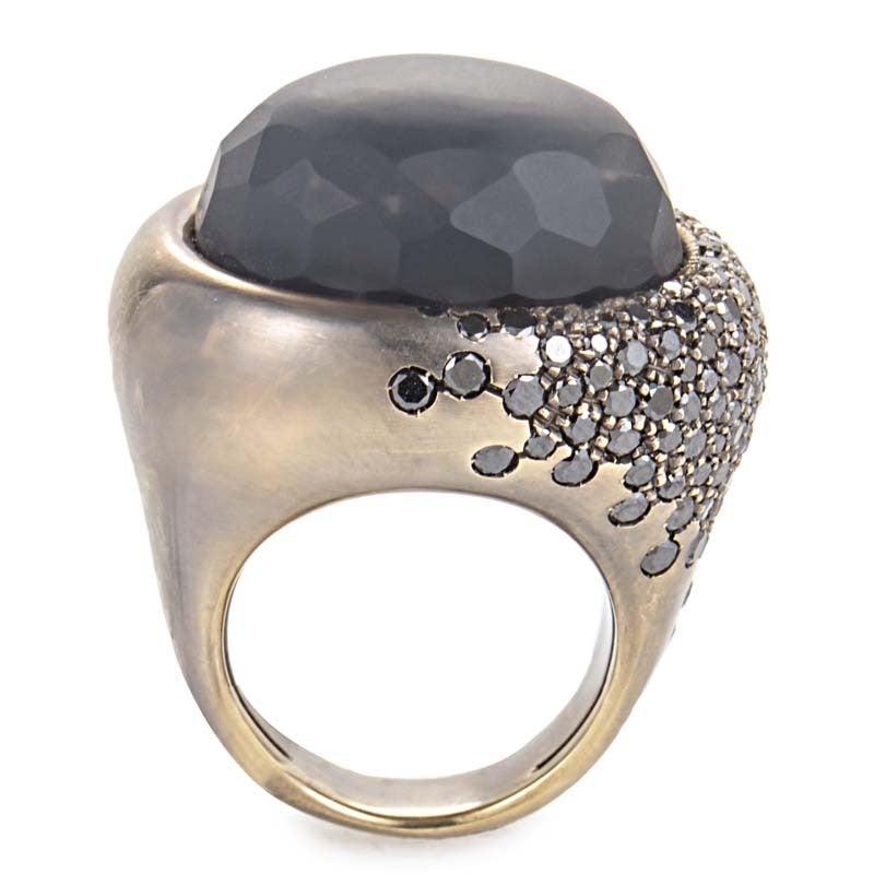 This Preziosismi ring is alluring and modern. It is made of rhodium-treated 18K white gold and sports shanks which are sprinkled with black diamonds: the perfect accompaniment to the ~32.75ct obsidian main stone.

Diamond Carat Weight: 2.80
Ring