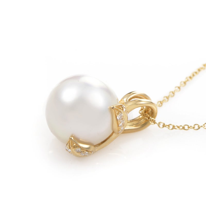 This pendant necklace from Tiffany & Co. is tasteful and radiates a subdued beauty. It is made of 18K yellow gold and features a single white pearl pendant accented with an ~.24ct of diamonds.
Included Items: Manufacturer's Box
Approximate
