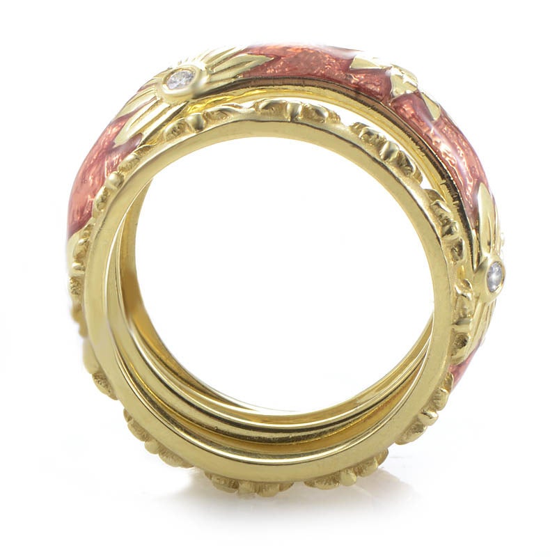 Hidalgo rings are perfect for stacking and mixing and matching! This set of band rings from the brand are made of 18K yellow gold and all of the rings are accented with a lovely floral design. Lastly, the main ring also features a lavish red lacquer