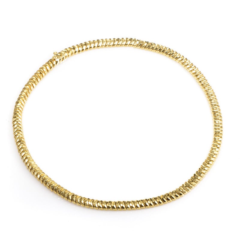 A rich length of rippling scales are the alluring detail of this magnificent necklace from Henry Dunay. Meticulously forged links of 18K yellow gold join in a bold statement of luxury and style.