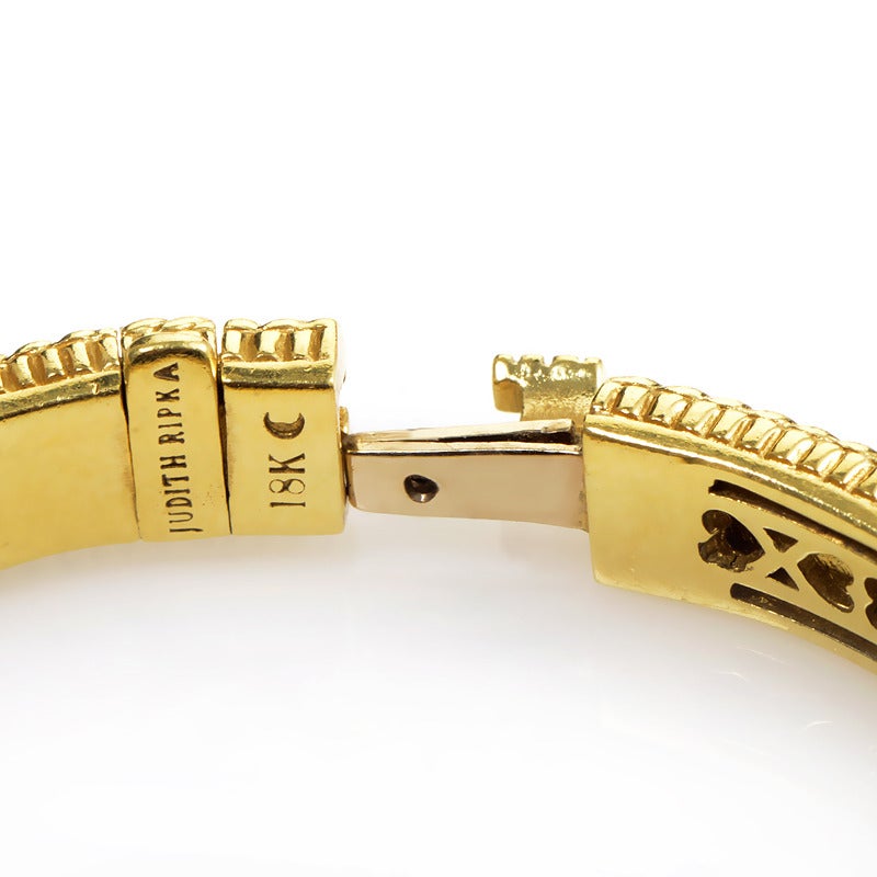 Loving sentiments are placed meticulously throughout this 18K yellow gold design from Judith Ripka. The finely patterned rims of this bracelet chase a perpetual stream of 2.50ct of diamonds, its thread intermittently enhanced with a diamond-infused