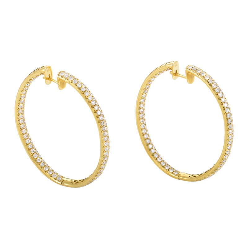 This decadent pair of hoop earrings from Odelia are classically designed and tantalize with their exquisite diamond pave. The earrings are made of 18K yellow gold and are encrusted with a full ~6.50ct diamond pave.
Retail Price: $23,600.00 (Plus