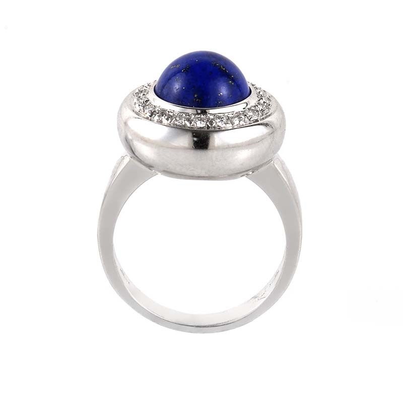 This ring from Piero Milano features a striking bezel set lapis cabochon that is sure to catch one's eye. The ring's setting is made of 18K white gold and the bezel is set with ~.28ct of diamonds.
Ring Size: 7.5 (55 1/4)
Retail Price: $6,260.00