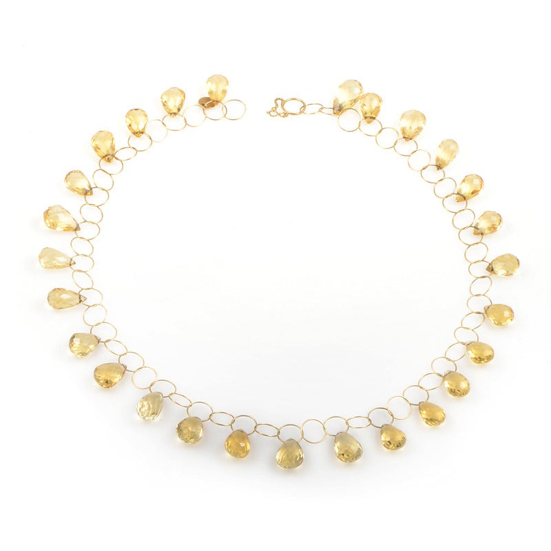 Precision and elegance, the hallmarks of Mallary Marks design, are exemplified to perfection in this beautiful necklace. Teardrops of citrine are suspended from finely spun hoops of 18K gold, and are exquisitely linked into a perpetual orbit of