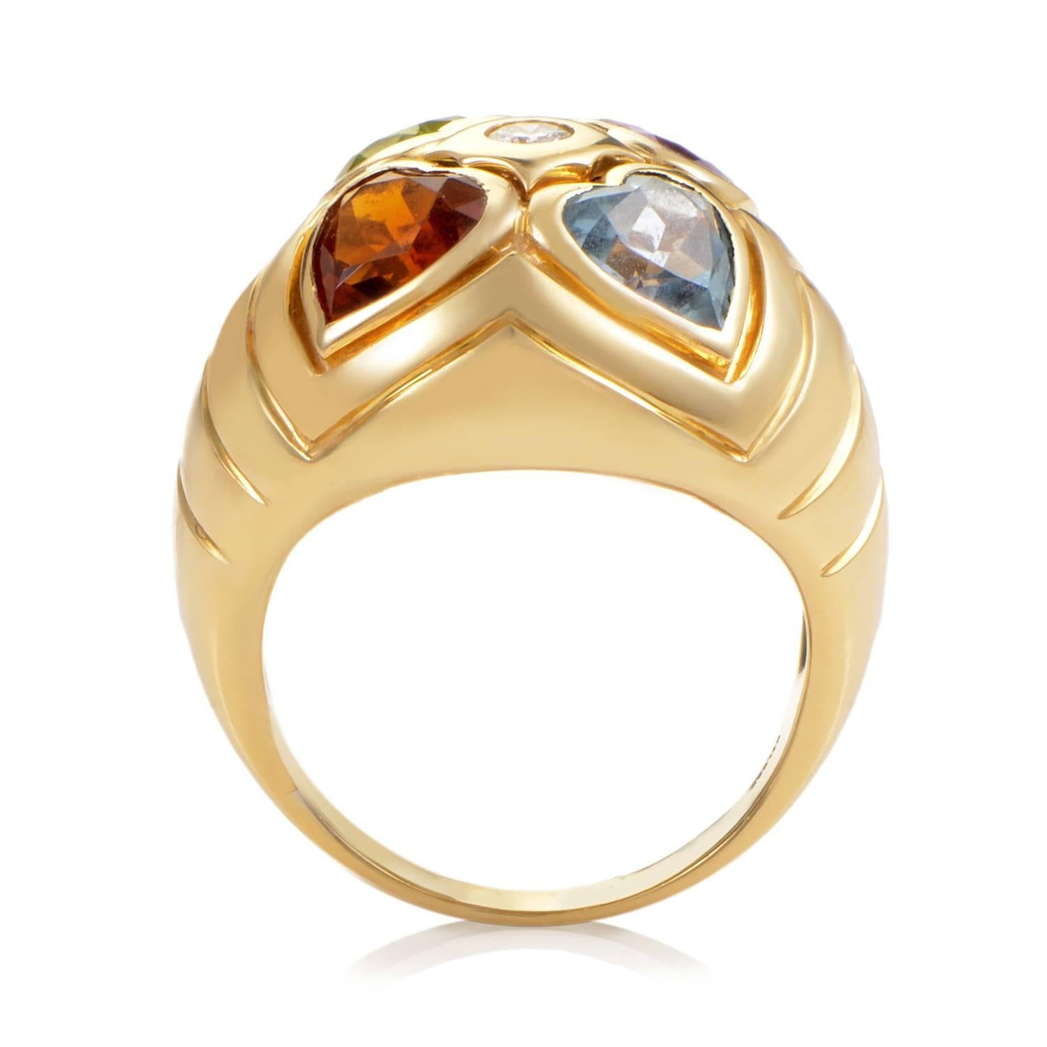 Bulgari offers a rich array of precious elements with this captivating ring design. The band quickly ascends into a broad display of 18K Yellow Gold, ripples resonating in the meatl near its peak. At the center, a glittering diamond, as four