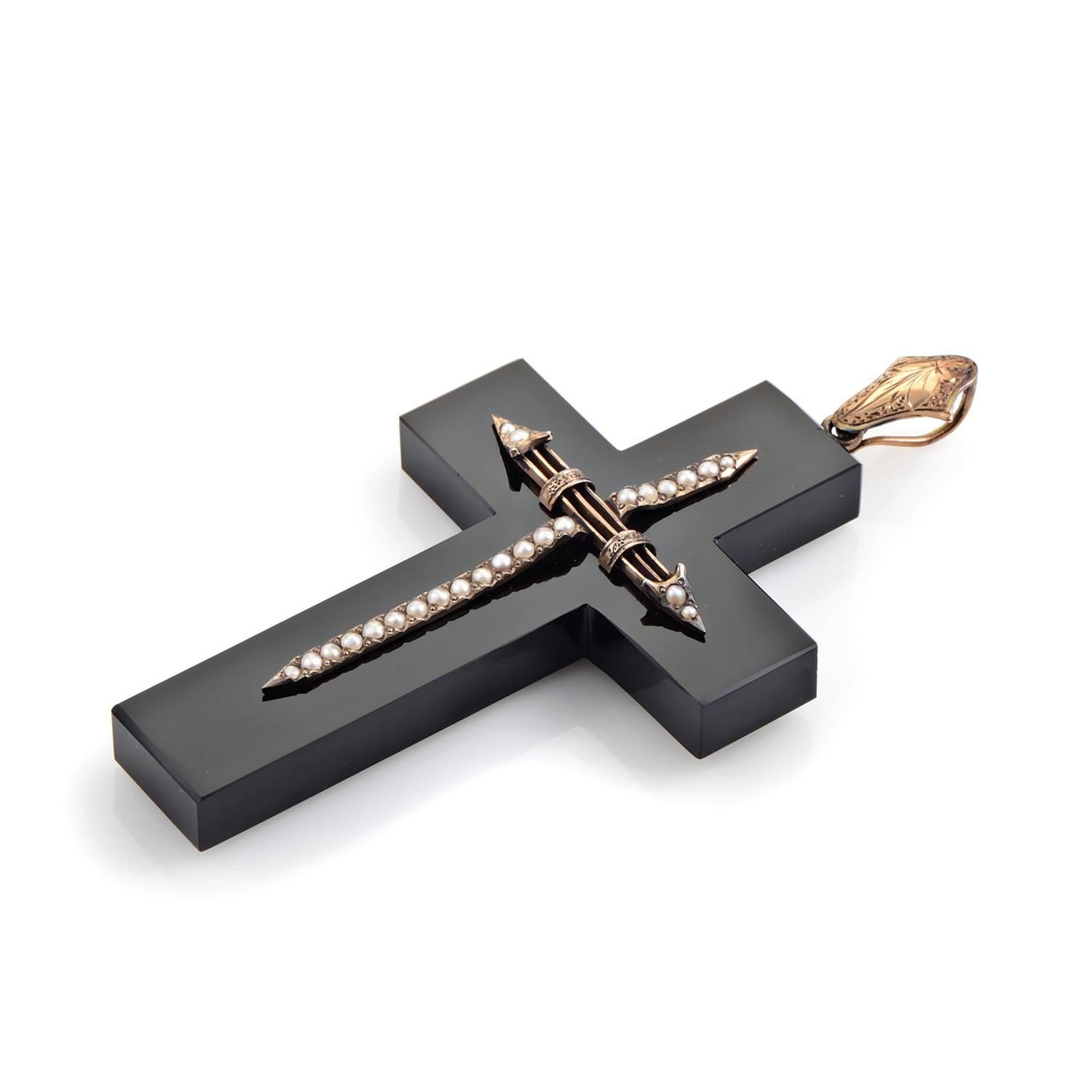 This breathtaking religious pendant is perfect for somebody who enjoys bold fashion statements. The pendant is made of black onyx and is accented with 14K rose gold. Lastly, petite pearls add a dazzling touch to the overall design.