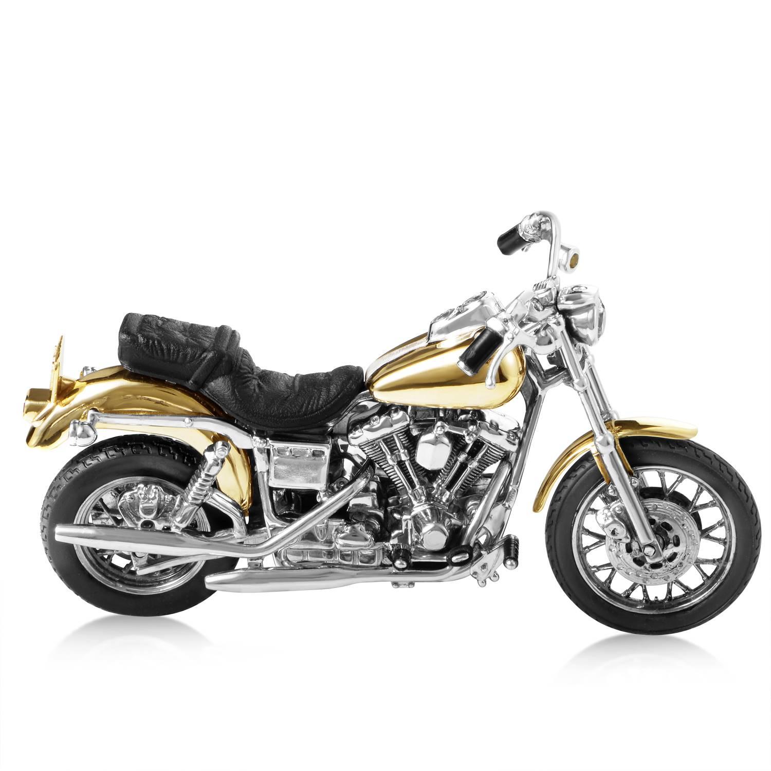 Built with luxury parts only! A magnificent design built on a classic, this reproduction of the Harley Davidson Dyna Low Rider lures the eye into its fine details. 14K yellow gold and sterling silver are the primary roar behind this one-of-a-kind