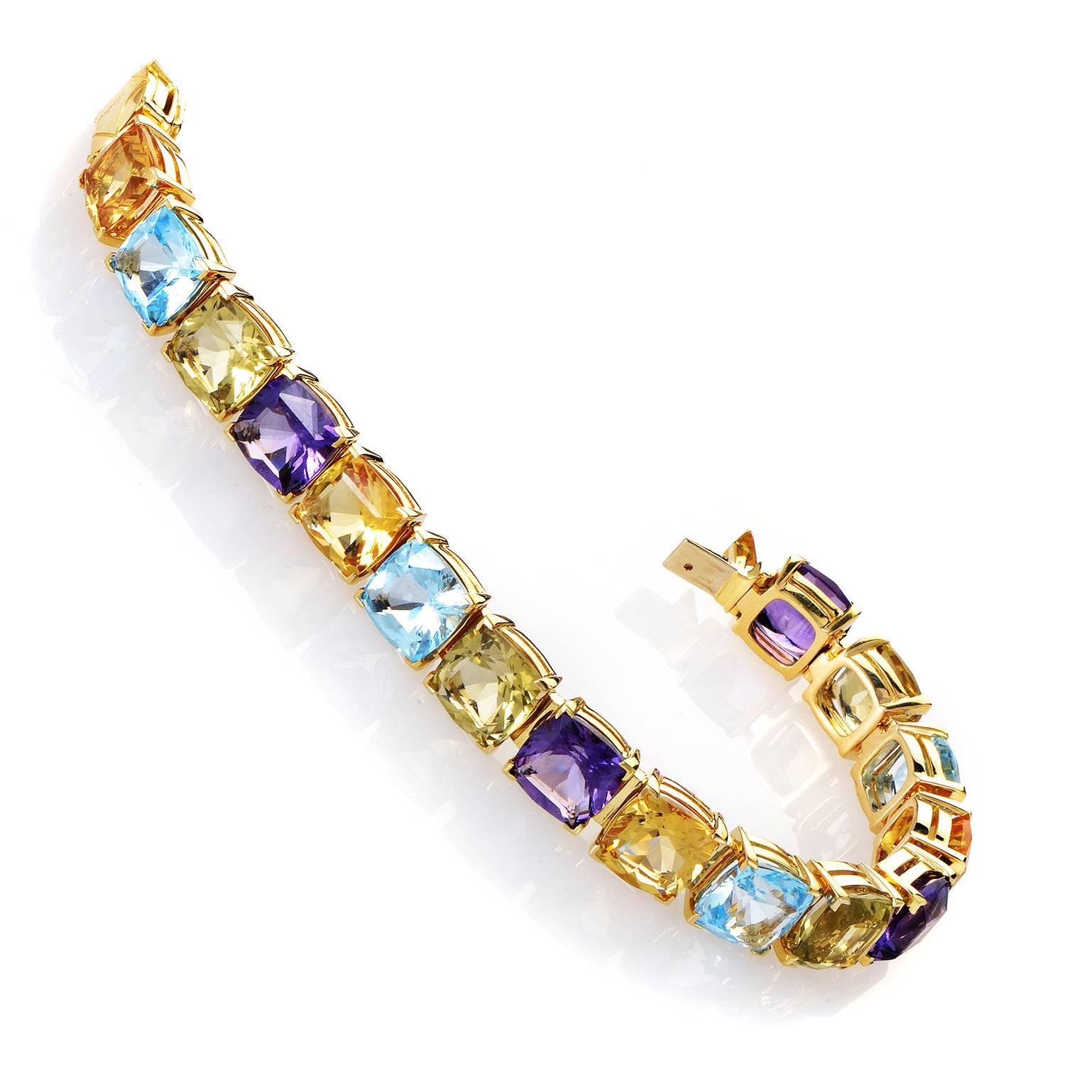 A kaleidoscopic spectacle from Asprey! A circle of shimmering stones is on display in evenly distributed settings of Citrine, Lemon Quartz, Amethyst and Topaz. This perpetual merry go 'round of colors is cinched together by the integral spin of 18K