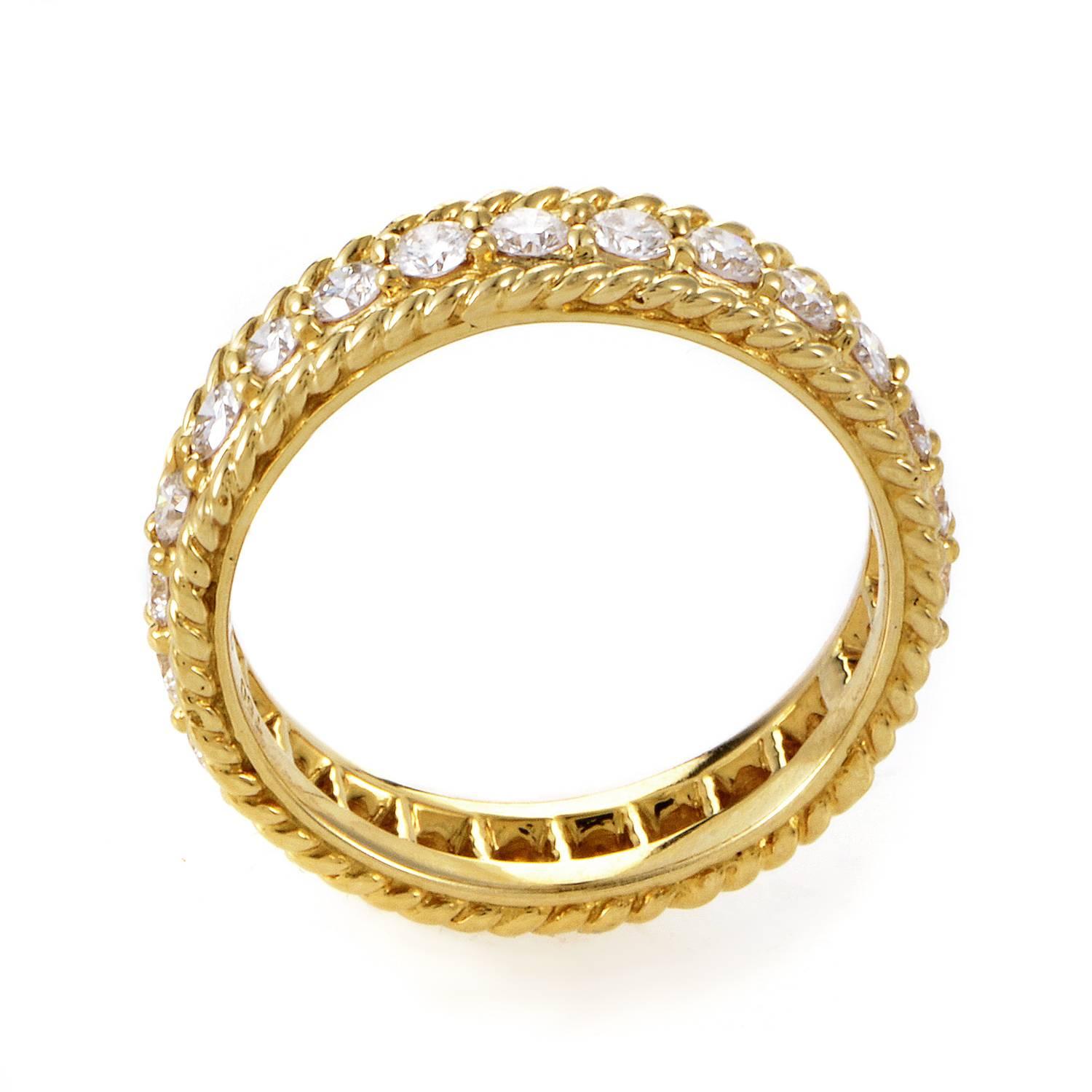 Eternal love and perpetual luxury converge in this magnificent design from Dior. The 18K Yellow Gold band turns with ripe, threaded texture. Channeled within the band's fine details, a stream of shimmering 1.25ct diamonds. This dazzling wedding band
