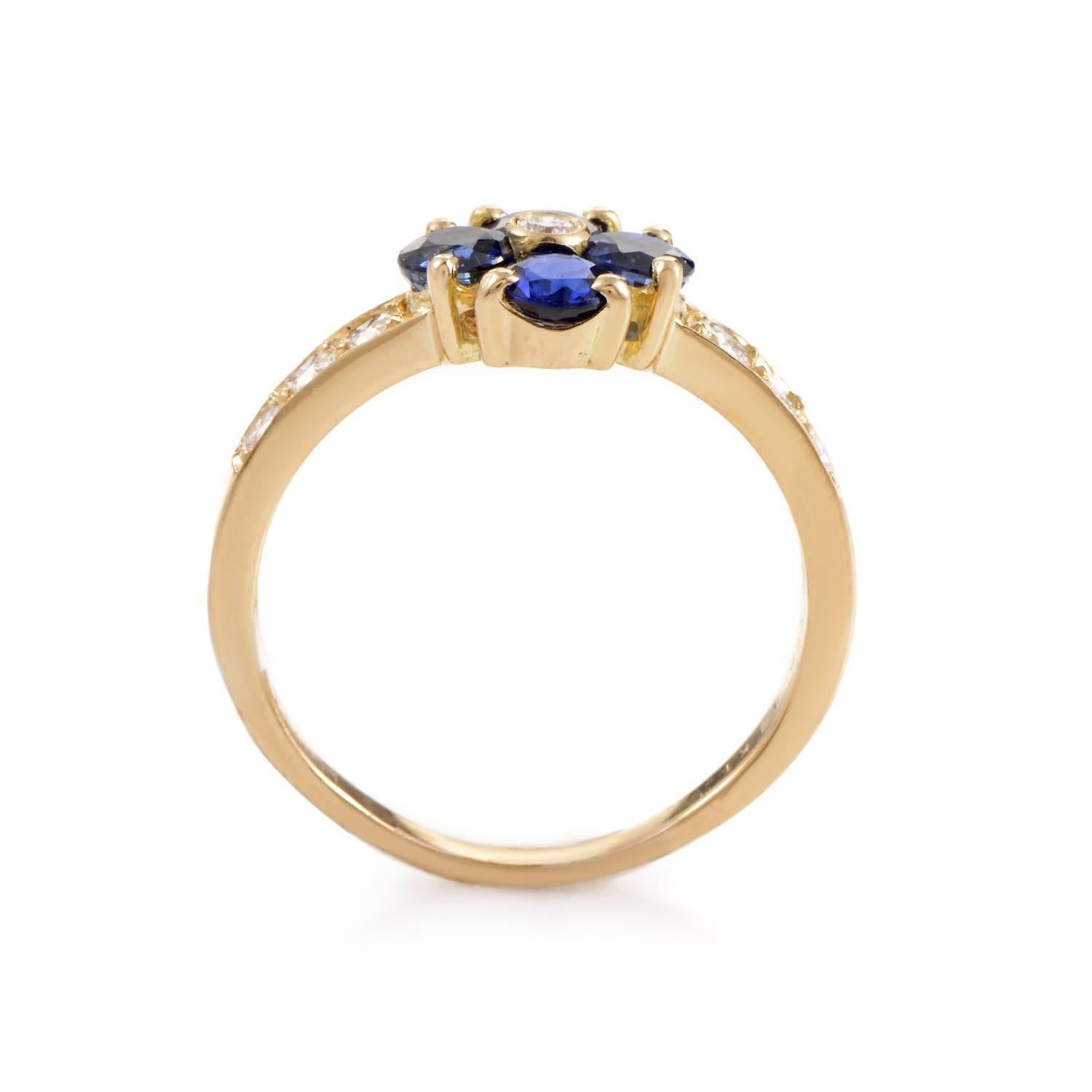 Simple and sweet are the perfect words to describe this gem-set design from Van Cleef & Arpels. The ring is made of 18K yellow gold and features shanks set with diamonds. Lastly, a single flower made of sapphires and a diamond steals the show.
Ring