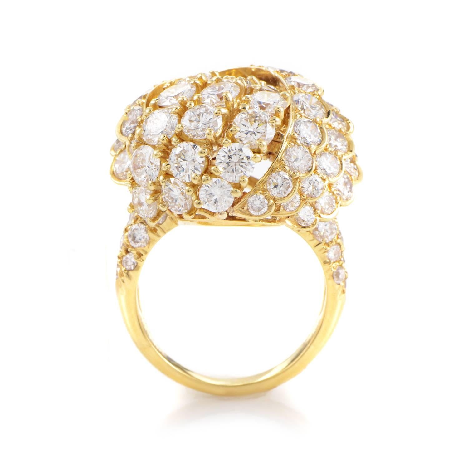 Magnificently designed and lavishly paved with glittering diamonds weighing in total approximately 6.00 carats, the 18K yellow gold body of this remarkable ring from Van Cleef & Arpels combines its bright radiance with an imaginative