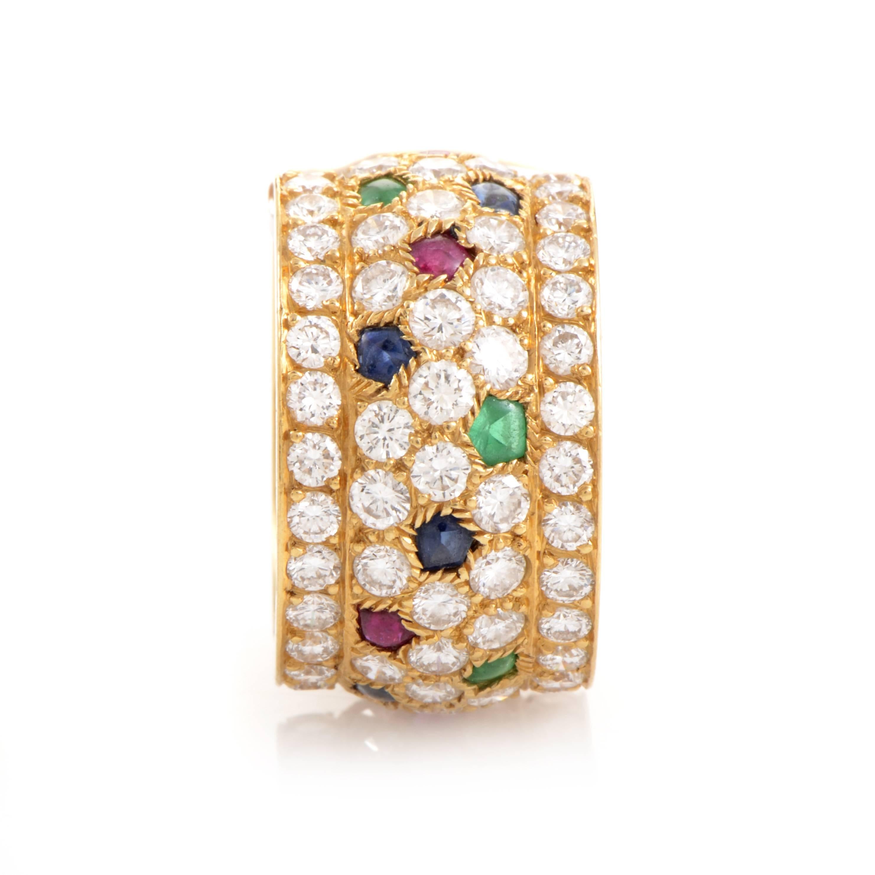 The brilliance of Cartier design makes a kaleidoscopic showcase in this stunning ring. The wide expanse of its 18K yellow Gold band provides plenty of room for sapphires, emeralds and rubies to add vibrant color to a generous tide of 5.00ct