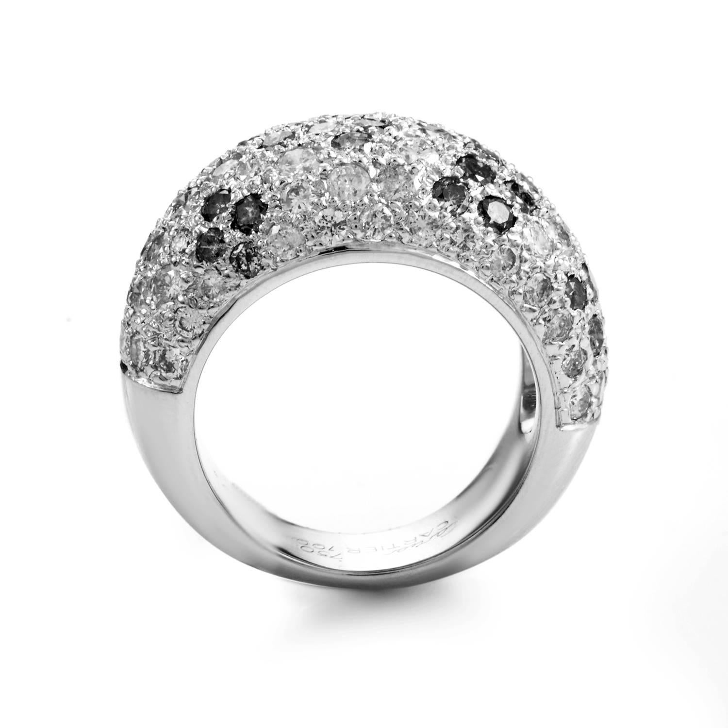 Black and white diamonds perform to stunning effect in this ring design from Cartier. Like a bed of exotic coral reef glimpsed through Arctic seas, the band's hearty expanse of 18K White Gold rises through a shimmering spill of precious stones. The
