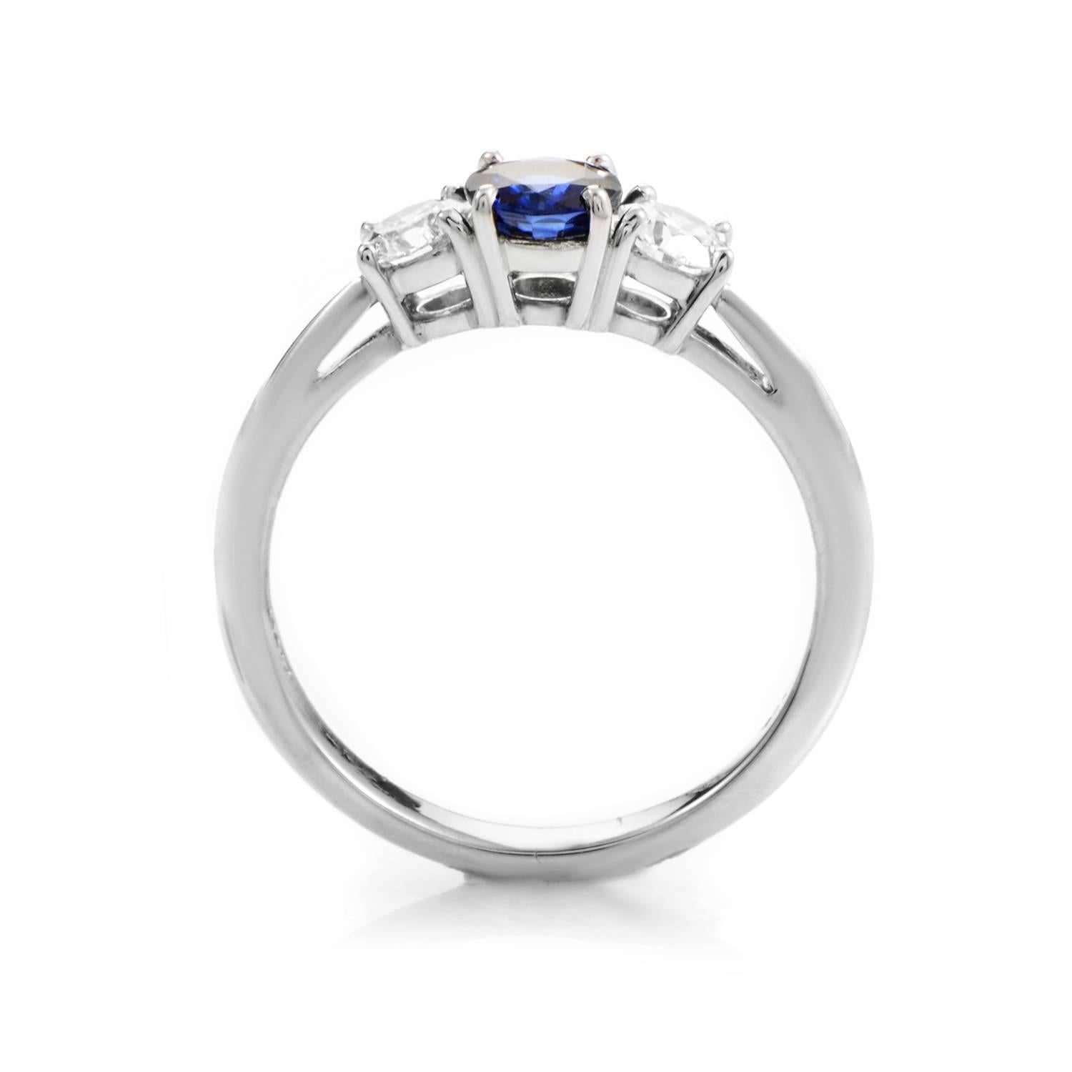 Tiffany & Co. combines a delightful mix of precious stones with platinum in this classically elegant design. The ring is made of platinum and boasts an alluring .50ct blue sapphire main stone. Lastly, the main stone is flanked on both sides by round