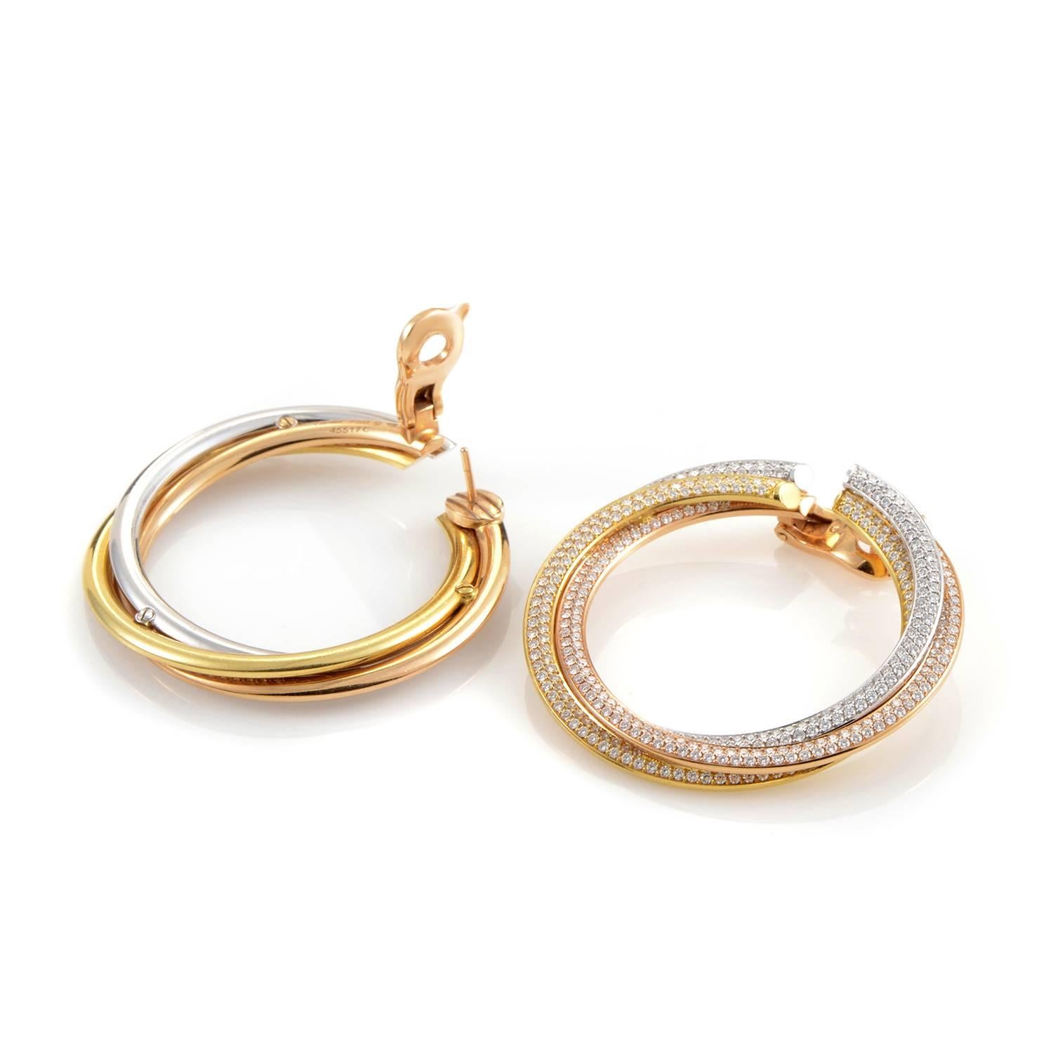 Luring your gaze with the everlasting glare of delicate diamonds amounting to 7.35 carats, this exquisite pair of earrings from Cartier leads the eye along its graceful lines, enchanting in its prestigious blend of 18K rose, white and yellow