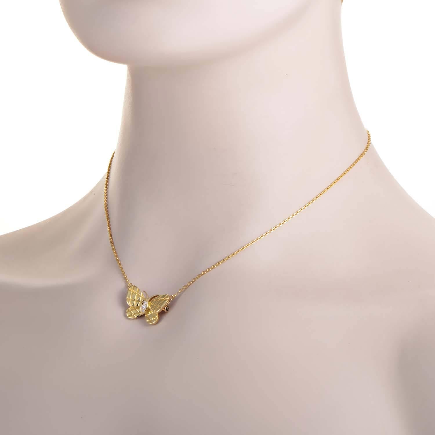 A sentimentally charming piece by Van Cleef & Arpels, this 18K yellow gold necklace is beautifully embellished with a butterfly pendant with the dual function of a brooch. The chain is cleverly clasped onto the pendant with ring spring clasps on