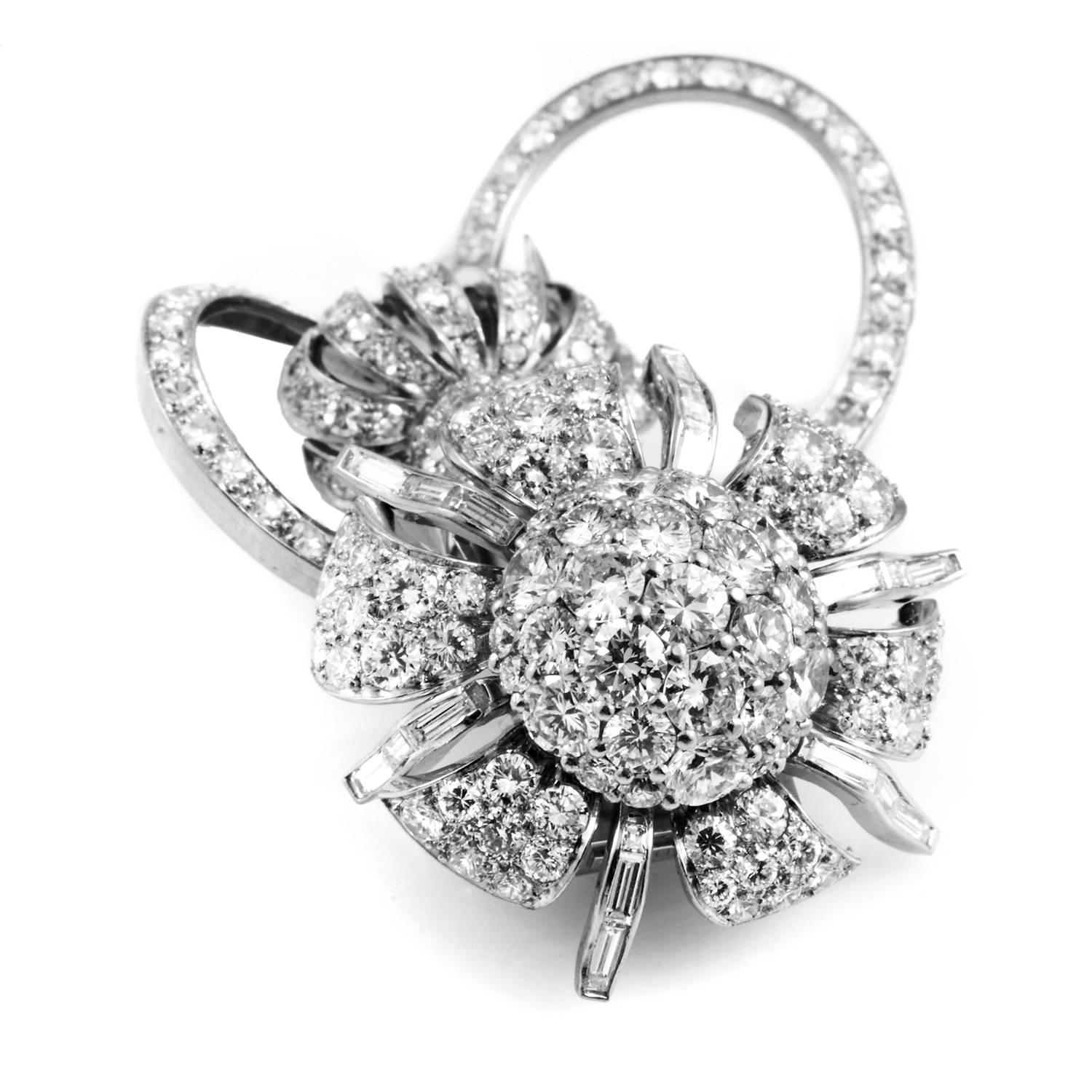This regal brooch by Bucherer is a resplendent piece of fine craftsmanship. Made with platinum and fashioned into a crown above a flower with diamond encrusted halos, ~6ct of diamonds dazzle from the pave settings that encapsulates their beauty.