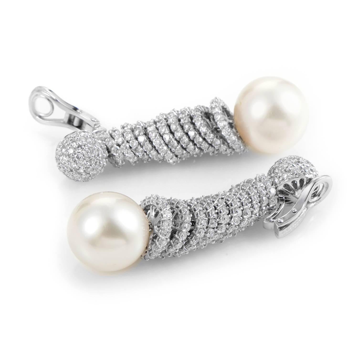 Perfectly complementing the scintillating blend of 18K white gold and glittering diamonds above, the pearls in this lavish pair of earrings from de Grisogono bring a delightful tone into the charming design, exuding delicate beauty through their