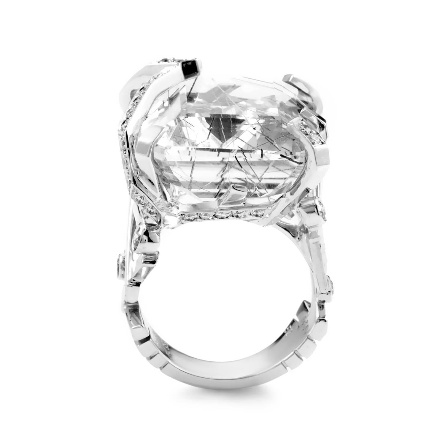The pristine white form of this Chanel ring is given a bold and edgy touch to make it stand out in a crowd. The ring is made of 18K white gold and boasts uniquely designed shanks set with diamonds. Lastly, the ring holds a faceted white rutilated