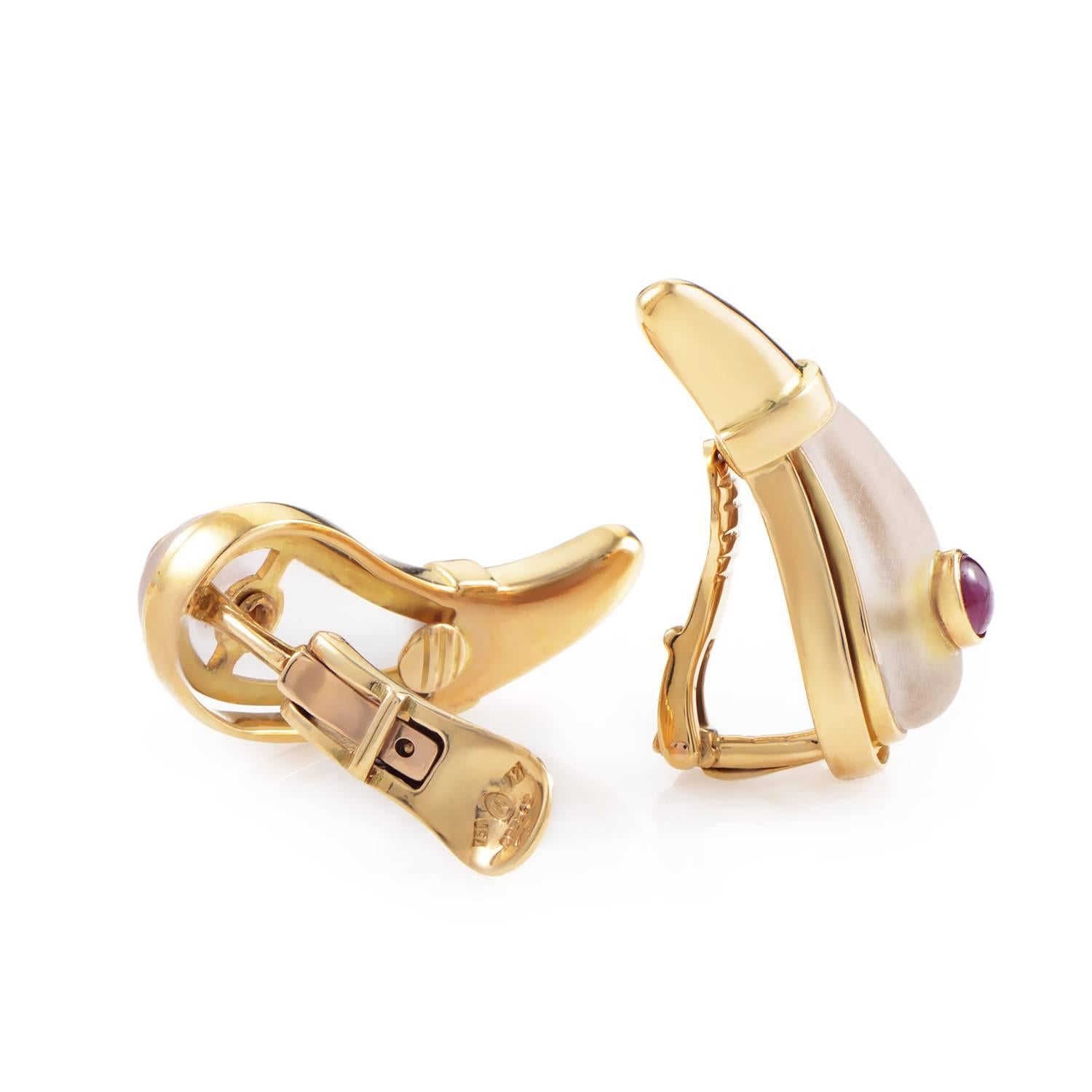 Ilias Lalaounis designs are exceptionally unique and painstakingly crafted. This pair of teardrop-shaped earrings are made of 18K yellow gold and are set with white crystal and ruby cabochons.
