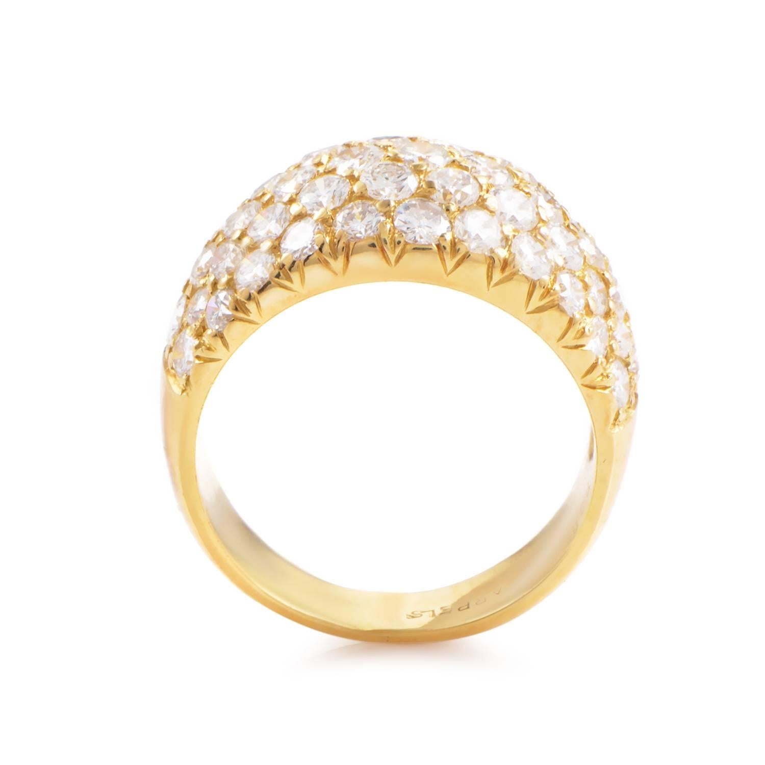 Van Cleef & Arpels has created a gorgeous ring design. 18K Yellow Gold expands into a bold band. As it crests the stunning spill of 2.36ct diamonds accentuates its arc. Weighing 6 grams and boasting the brand's 