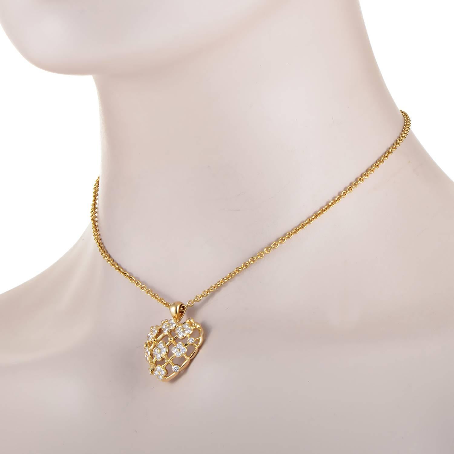 Loving sentiment bursts with floral finesse in this pendant choker necklace from Van Cleef & Arpels. The chain drops in a ripple of 18K Yellow Gold, and is anchored by the blossoming heart at the end of it. The heart motif is comprised of flowers