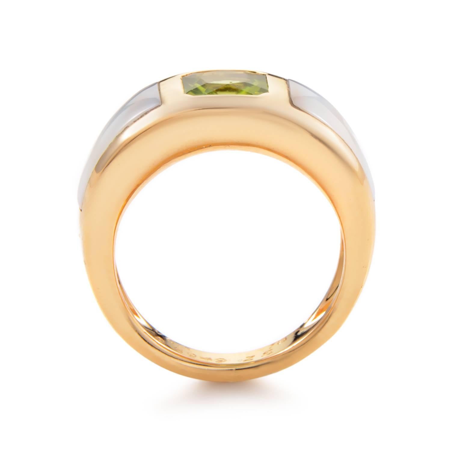 Feast your eyes upon the eye-catching design of this band-style ring from Van Cleef & Arpels! The ring is made of 18K yellow gold and is inlaid with mother of pearl and a single peridot stone.
Ring Size: 6.25 (52 1/8)
Band Thickness: 9mm