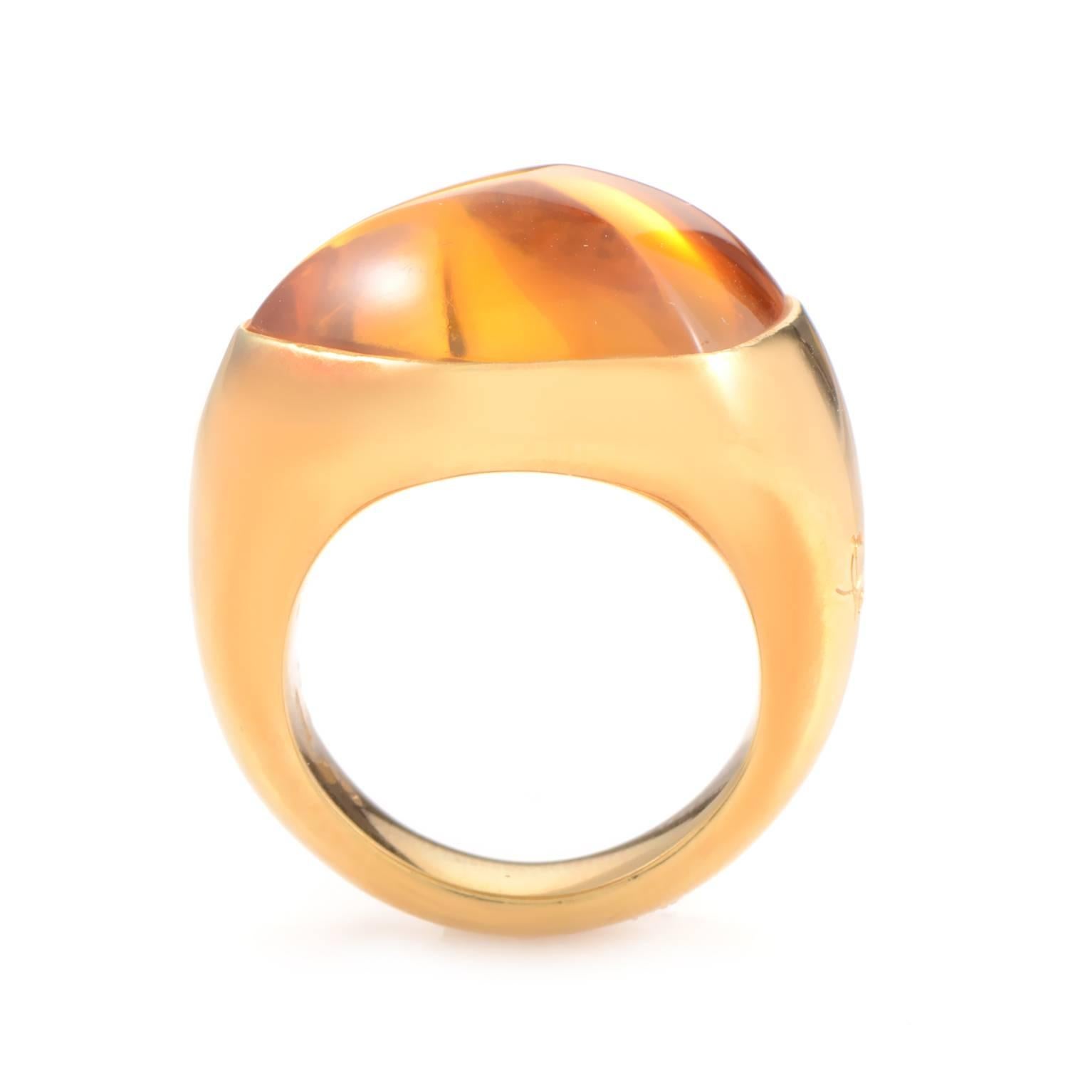 Warm golden hues are the hallmark of this lovely ring from Pomellato. The ring is made of 18K yellow gold and boasts a gorgeous citrine cabochon main stone.
Ring Size: 4.5 (47 3/4)
Band Thickness: 6mm 
Ring Top Height: 5mm 
Ring Top Dimensions: