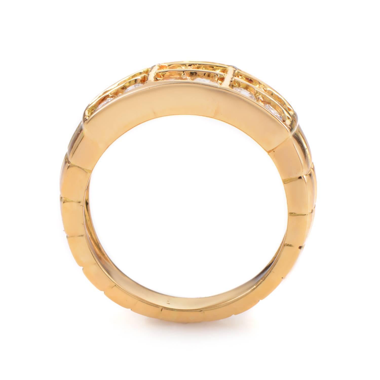 A resplendent ring by the well established house of Mauboussin, this 18K yellow gold tapered shank provides a warm, gleaming base and intriguing setting that gives the impression of bar settings while holding the ~1.10ct of diamonds in bright-cut