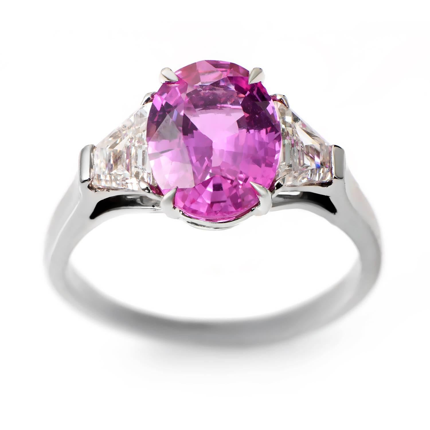 Made of prestigious platinum, this exquisite Bulgari ring boasts a stunning design that features a 3.37ct Burma pink sapphire (untreated). Lastly, the gorgeous main stone is flanked by two trapezoid-shaped diamonds weighing approximately .50ct