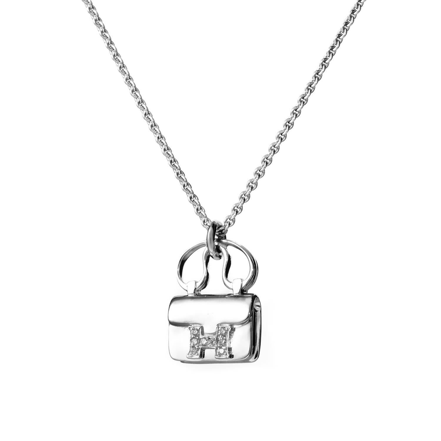 Fashionably elegant, this lovely Hermès necklace is made of tasteful 18K white gold and offers lovely feminine appearance, boasting a handbag-pendant accentuated with a diamond-set H. 
Pendant Dimensions: 12 x 16mm 
Pendant Thickness: