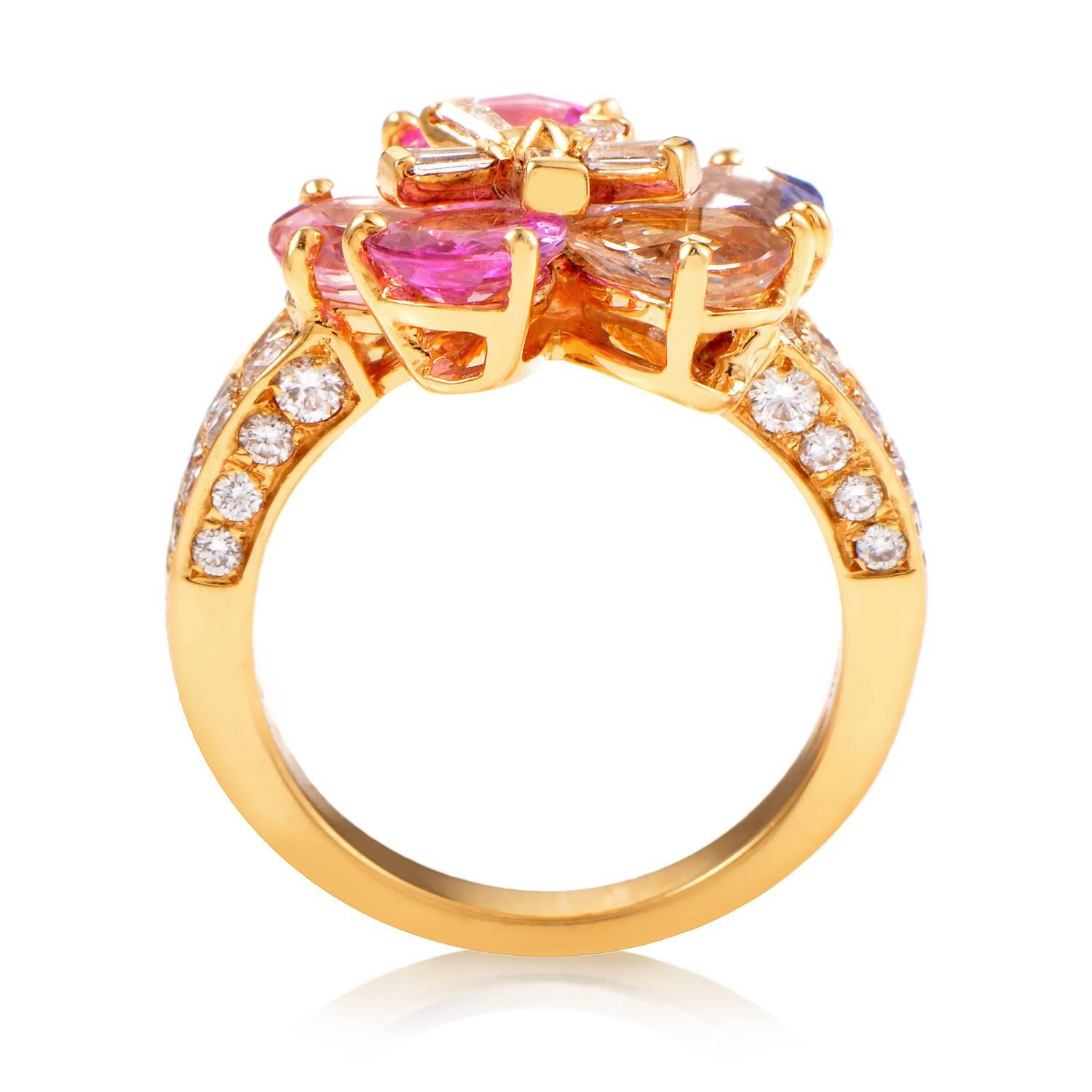 Brimming with life, light and color, this superb Bvlgari ring is a stunning tribute to art and fine jewelry. The ring is comprised of 18K yellow gold with a tapered shank paved in diamonds that add radiance to the already splendid array of multi