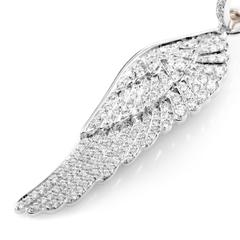 Boucles d'oreilles aile d'ange Garrard en or et diamants