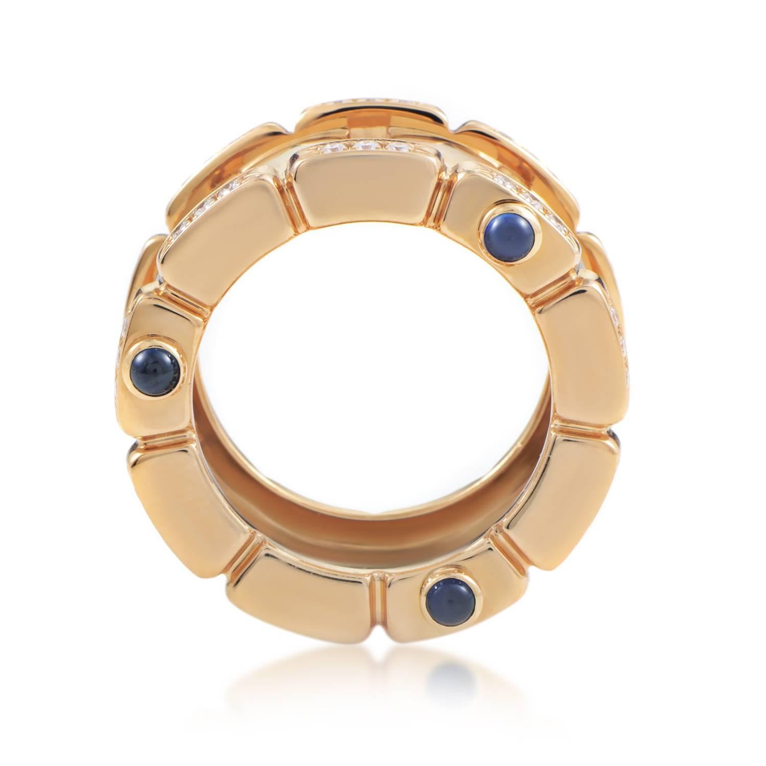A royal aura in this magnificent band from Patek Philippe is produced by the glamorous blend of radiant 18K yellow gold and glistening diamonds weighing in total 0.75ct contrasted tastefully by delicate sapphires on the sides.
Band Thickness: 12