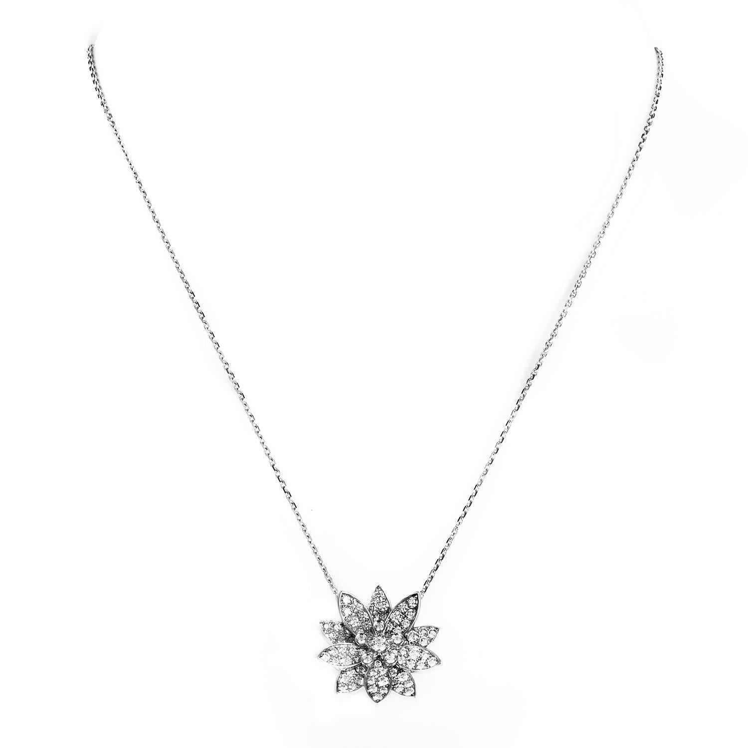 A truly mesmerizing end extraordinary depiction of a lotus flower in a delightfully feminine and luxuriously lavish spirit, the pendant of this astonishing 18K white gold necklace from Van Cleef & Arpels boasts a spellbinding arrangement of