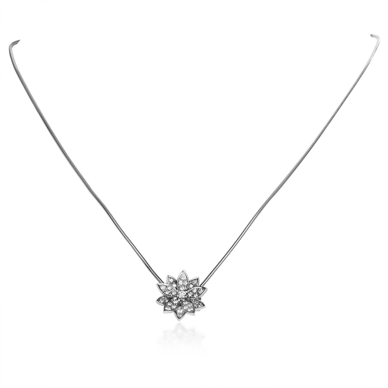 A scintillating and mesmerizing sight, the fascinating pendant of this elegant necklace from Van Cleef & Arpels epitomizes tasteful prestige, placing a majestic arrangement of glistening diamonds upon bright shimmering 18K white gold in the form of