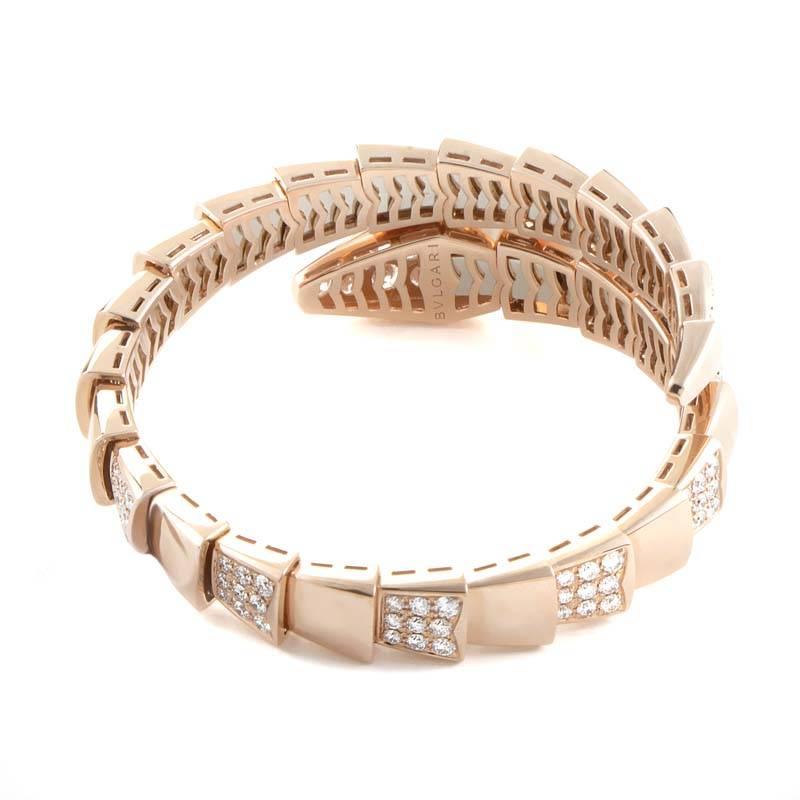 This exotic bracelet from the Bulgari Serpenti collection has a sensual design that wraps around the wearer's wrist like the snakes whose likeness it takes on. The bracelet is made of 18K rose gold and is set with a 5.17ct semi diamond