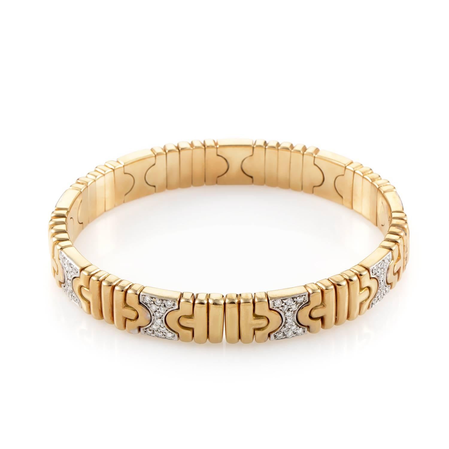 Embellished with the intriguing pattern which is a recurring theme in the brand's esteemed opus, this fantastic 18K yellow gold bangle from Bulgari also boasts 1.20 carats of glistening diamonds set upon several 18K white gold links for superb